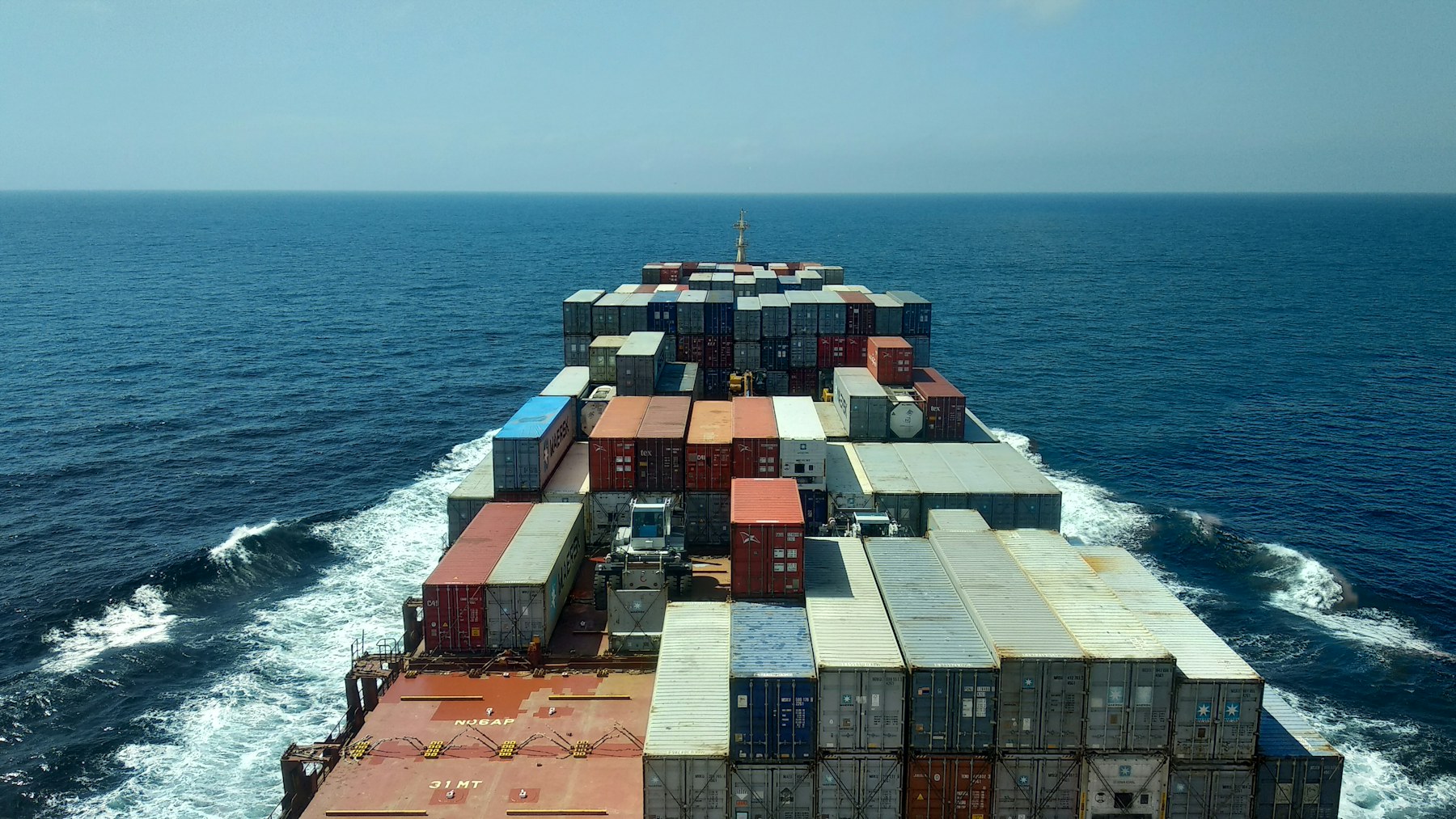 Cargo ship moving through open water