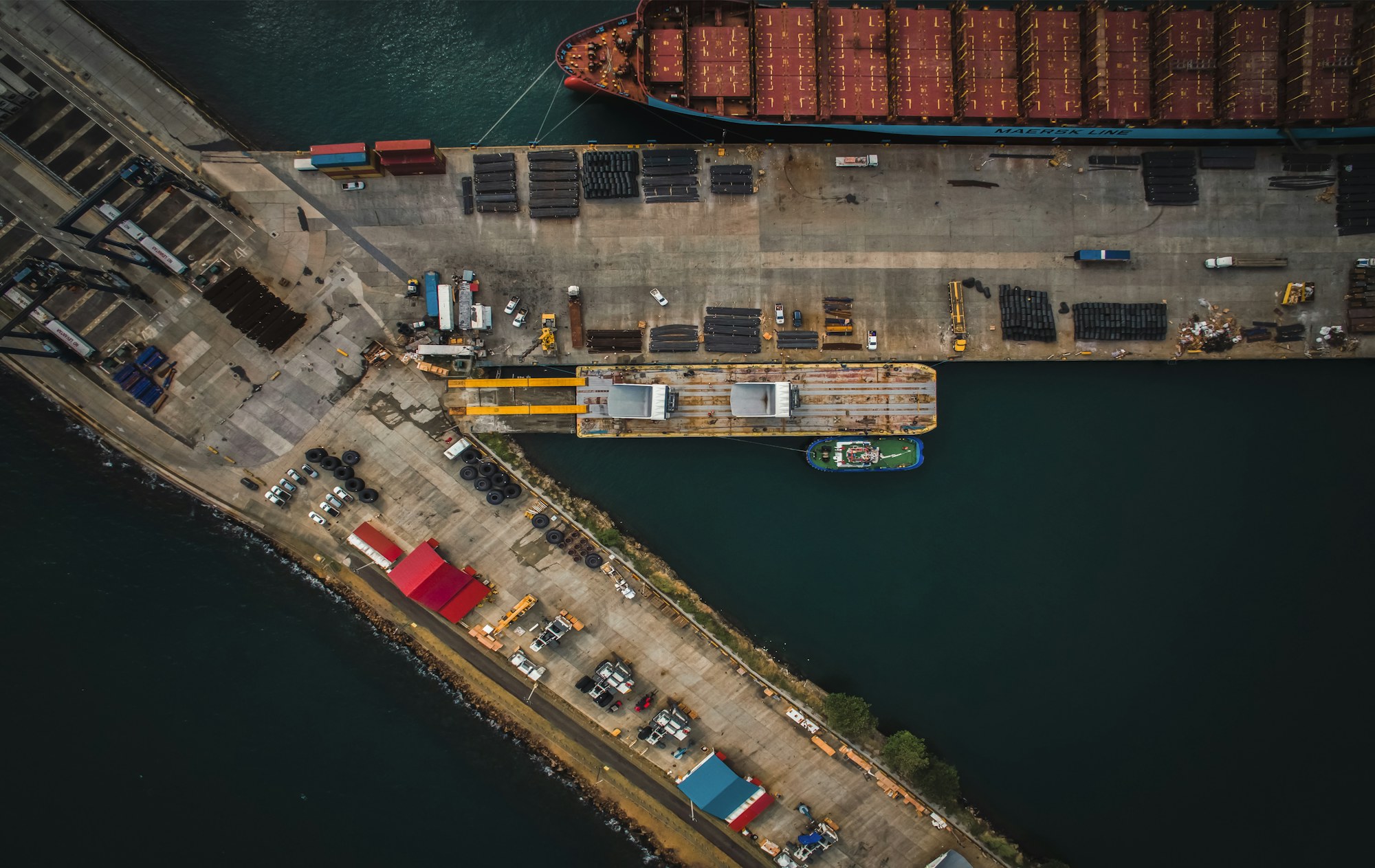 Aerial view of a cargo vessel at an industrial port