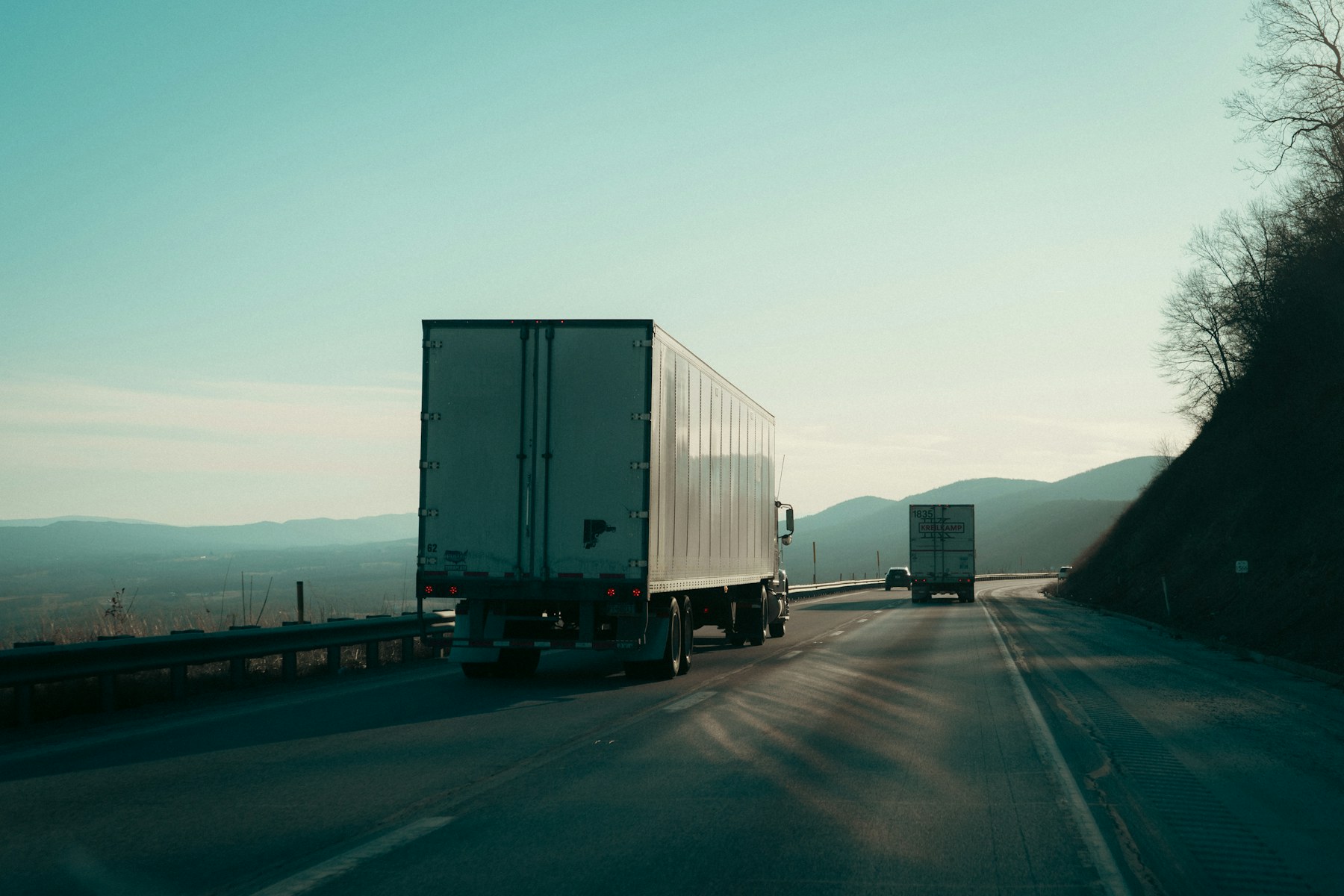 Freight trucks travelling on an open highway